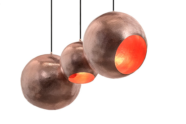 Modern sculptural hand made copper pendant lamp with a contemporary brown patina finish